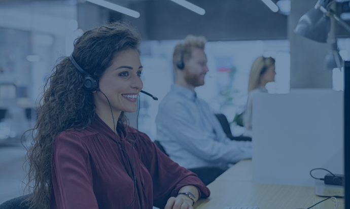 woman using headphone and smiling at call center